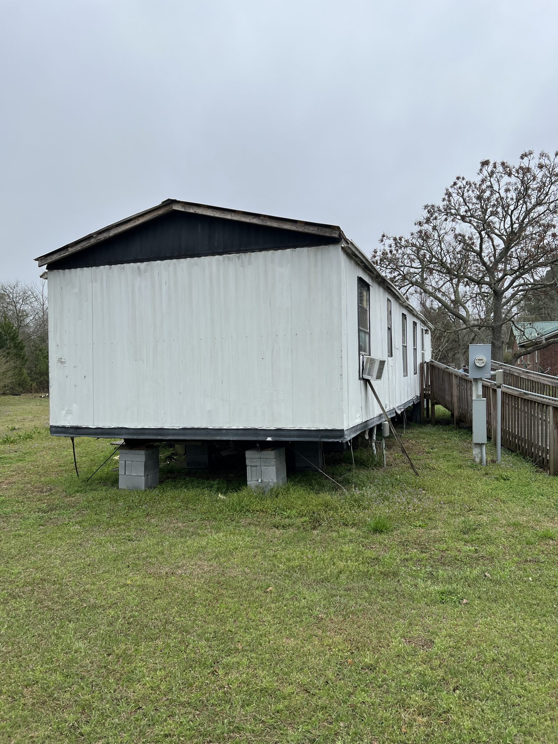 Professional mobile home leveling in Summerville, SC using hydraulic jacks and laser-guided systems to correct settling and restore level floors